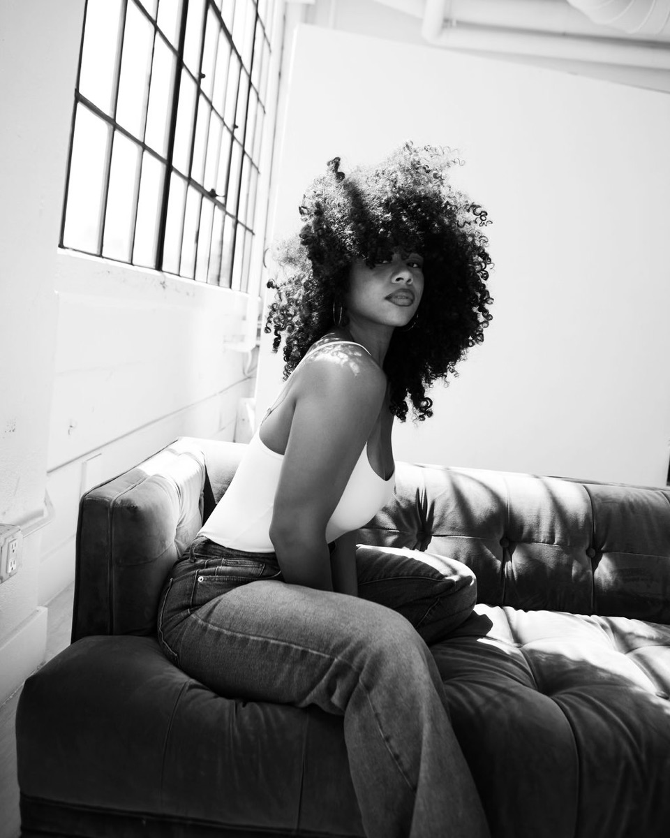 A sunlit black-and-white studio portrait photographed by Hope Kauffman.